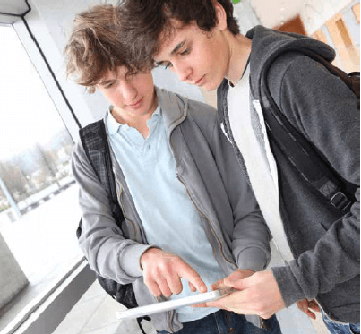 Two students looking at a tablet