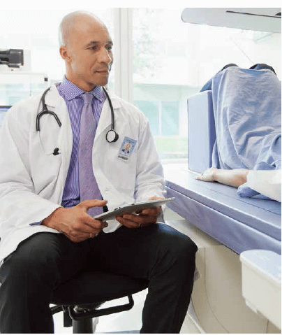 Male doctor using a tablet